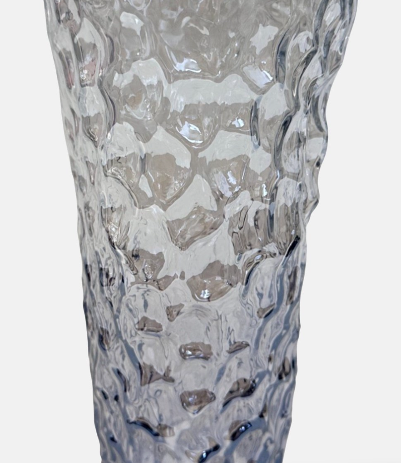 Close-up showing the organic textured surface of the Eightmood glass vase.