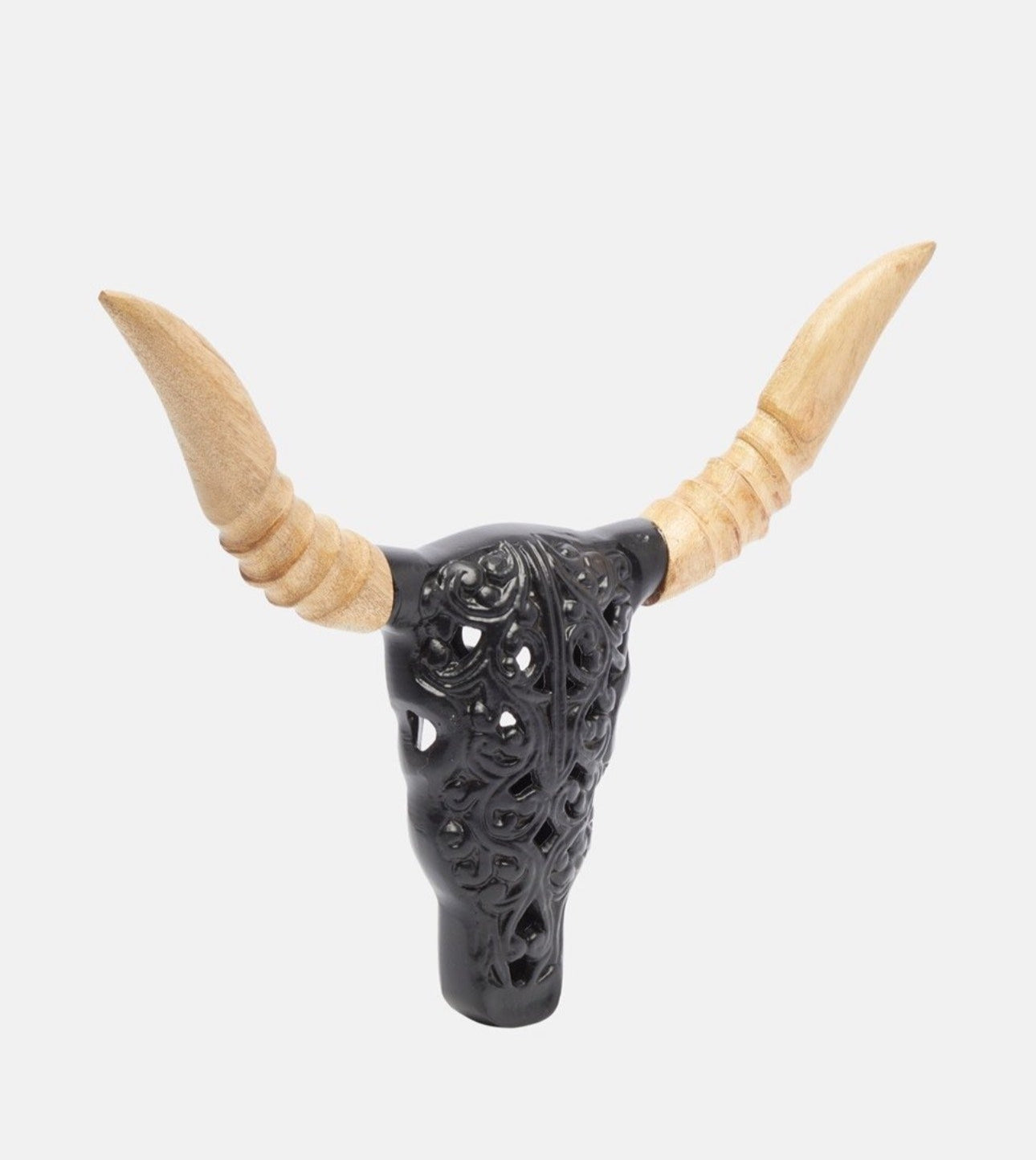 Side angle of carved metal and wood bull skull wall decoration