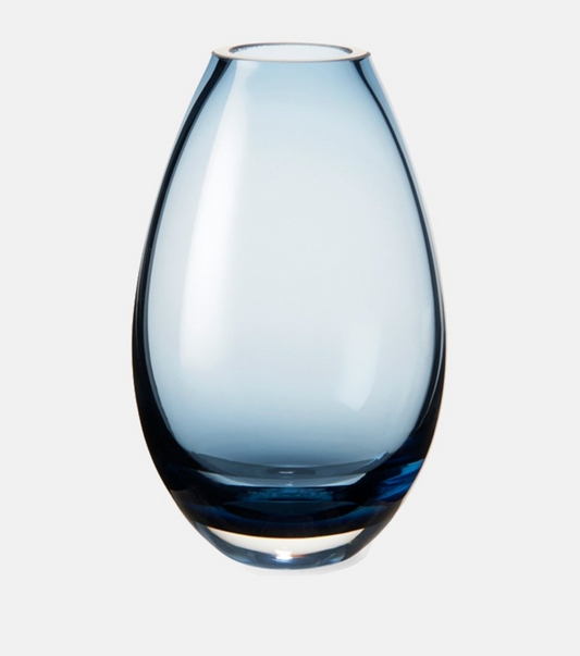 Holmegaard glass vase in soft blue with a sleek modern teardrop shape.
