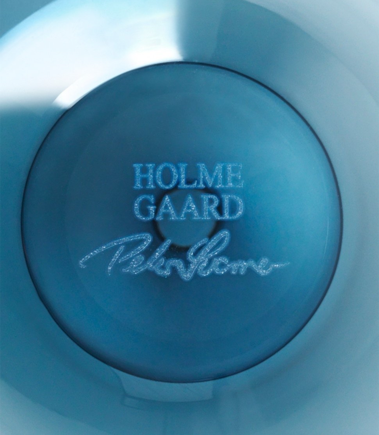 Base of the Holmegaard glass vase showing the embossed brand logo.