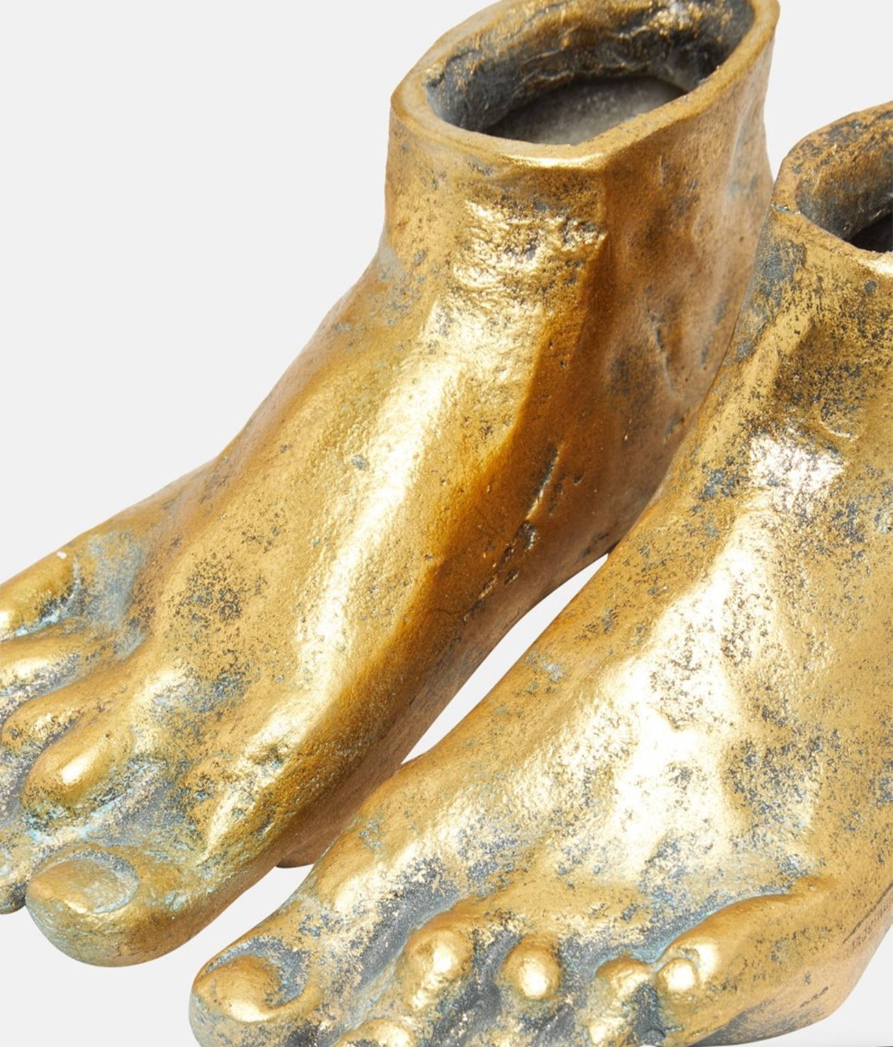 Close-up of the Lawrence Grey decorative feet highlighting the metallic gold texture.