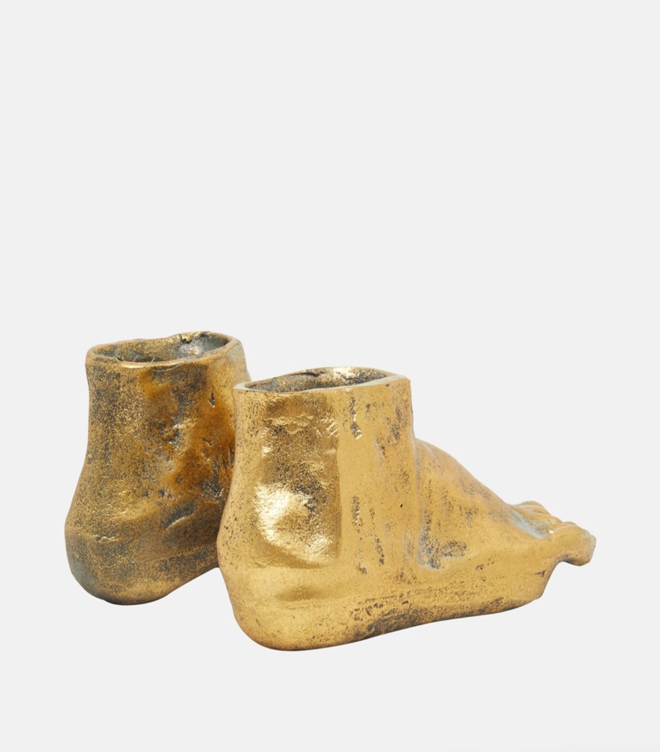Side angle of the golden feet decorative object with antique finish.
